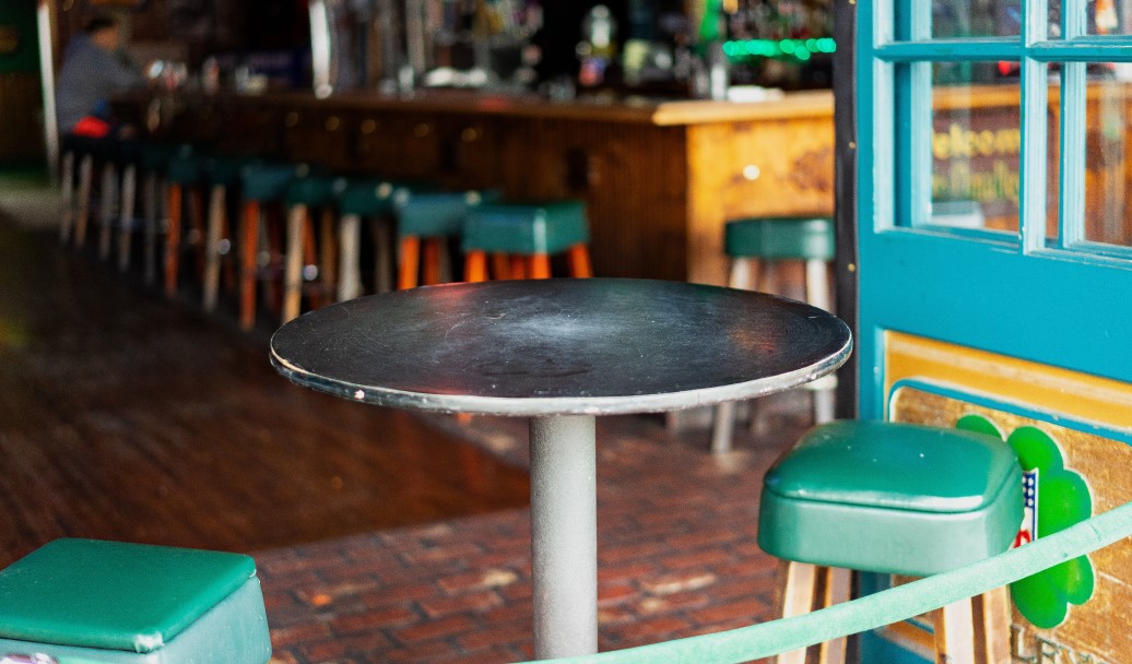 An image of bar stools and table
