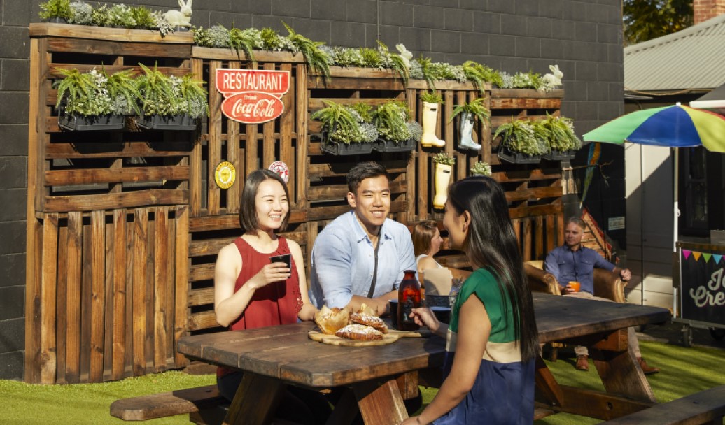 This is an image of people dining outdoors